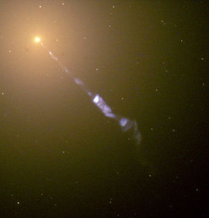 [Hubble Space Telescope image of a 5,000 light-year long jet being ejected from the active nucleus of the galaxy M87. The diffuse yellow background light is due to the unresolved stars in M87 while the blue glow of the jet is due to synchrotron radiation, a type of light emitted when charged particles are accelerated. Image credit: NASA and The Hubble Heritage Team (STScI/AURA). From http://en.wikipedia.org/wiki/File:M87_jet.jpg]